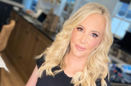 Shannon Beador in a black dress poses for a selfie.